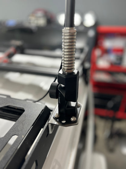 Close-up of a WeeBoost folding mount  mounted to side of roof rack using 90 degree bracket.